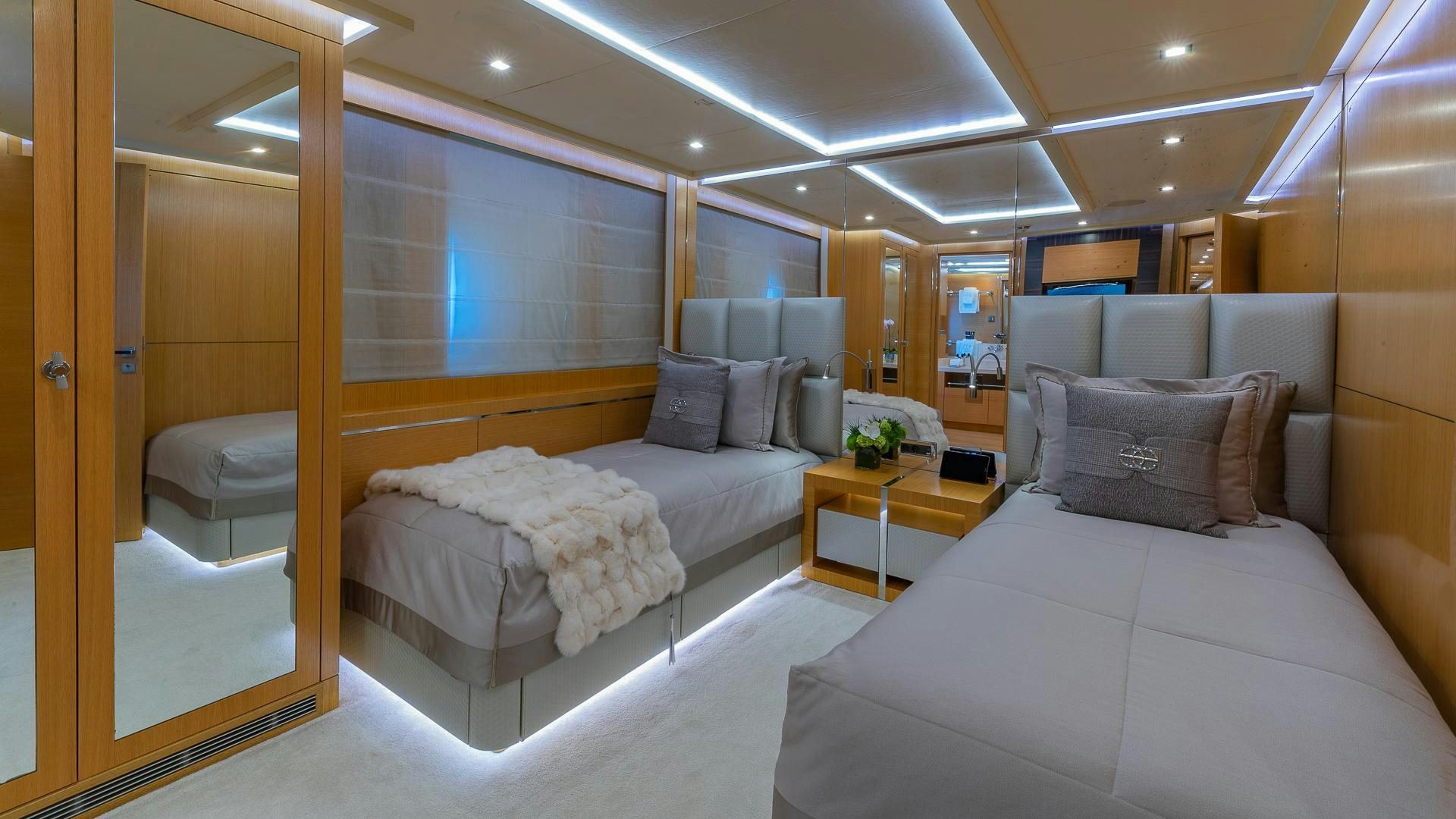 a room with a bed and a desk aboard DB9 Yacht for Sale