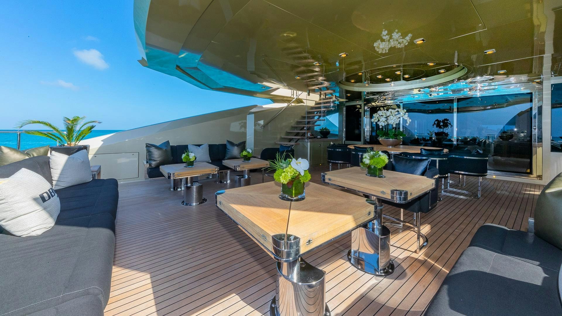 a room with a table and chairs aboard DB9 Yacht for Sale