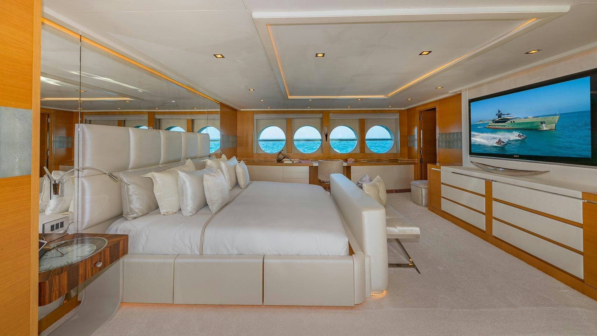 a living room with a large screen aboard DB9 Yacht for Sale