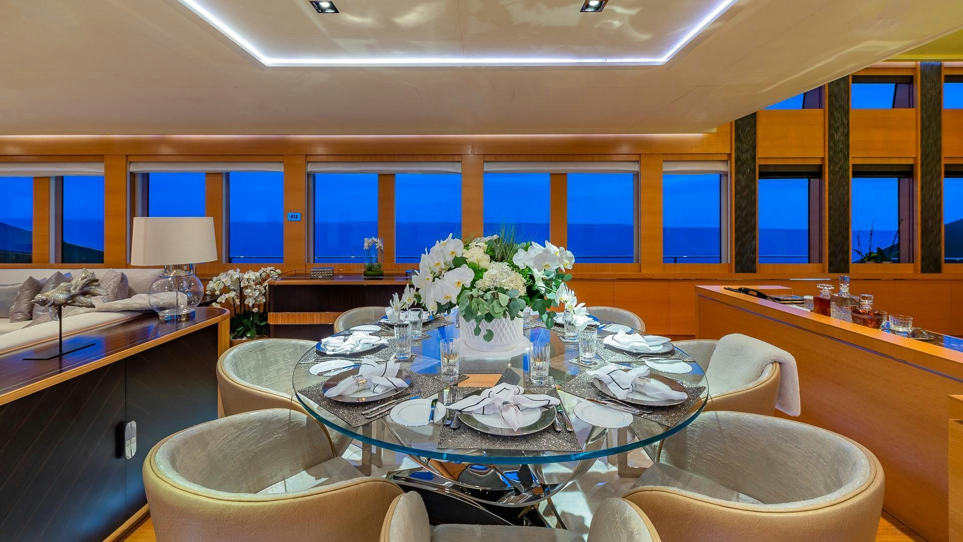 a large dining table in a room aboard DB9 Yacht for Sale