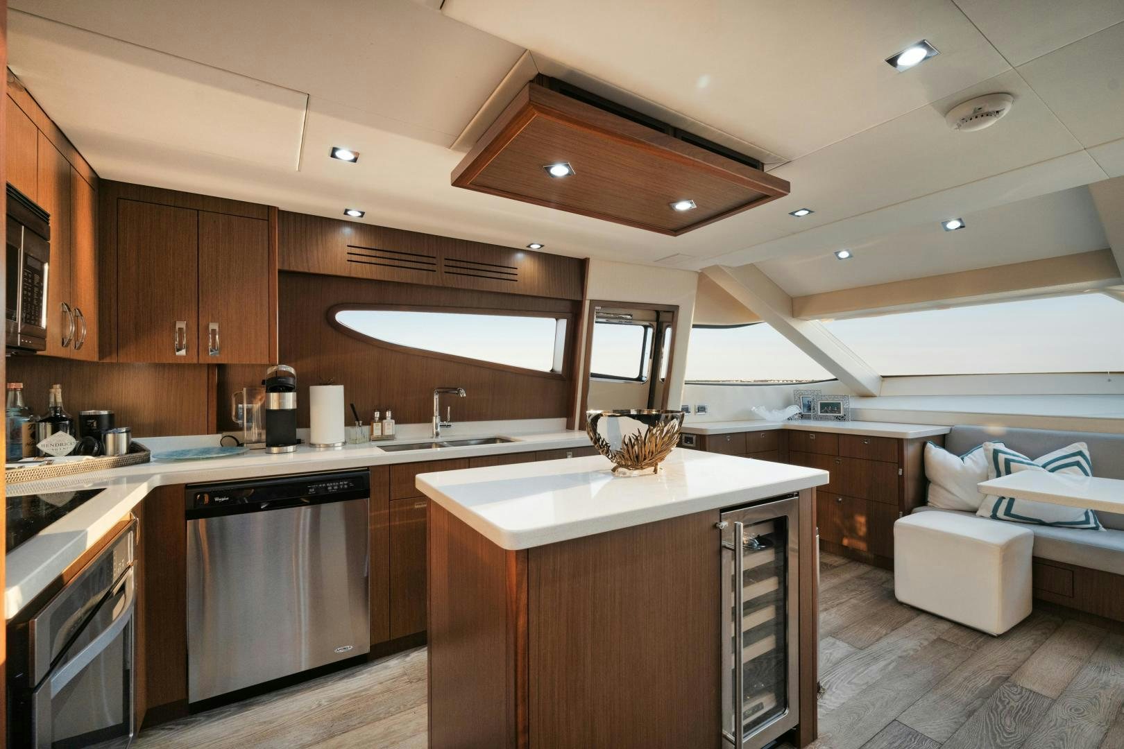 a kitchen with wooden cabinets aboard EMMY Yacht for Sale