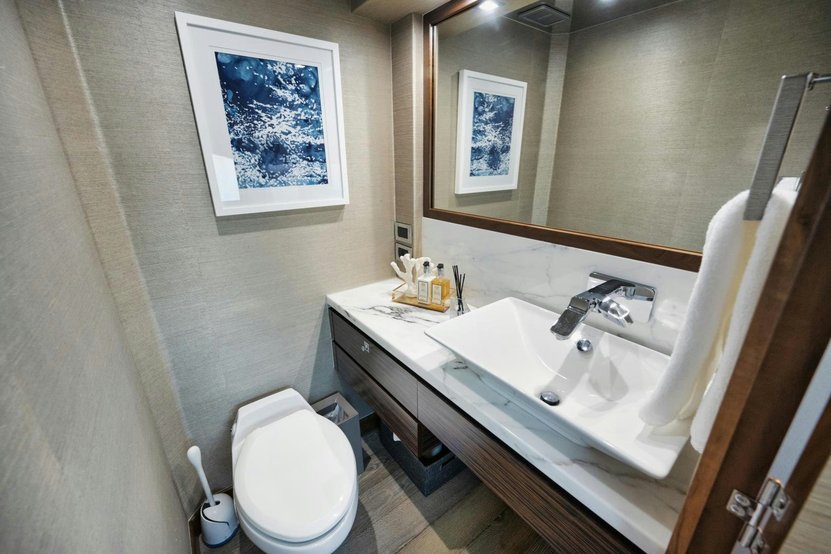 a bathroom with a sink and toilet aboard EMMY Yacht for Sale