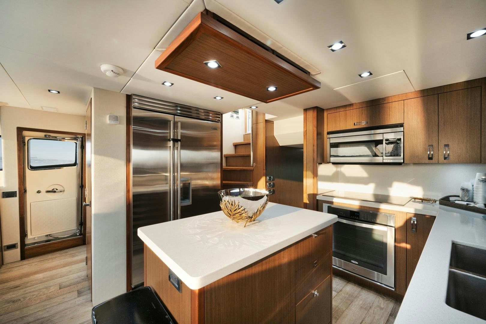 a kitchen with a large island aboard EMMY Yacht for Sale