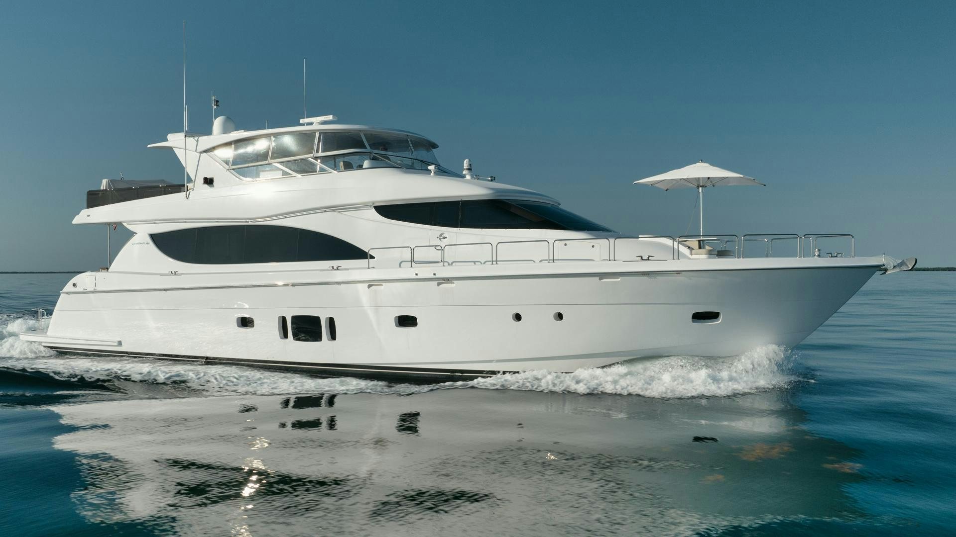 a white yacht in the water aboard Emmy Yacht for Sale