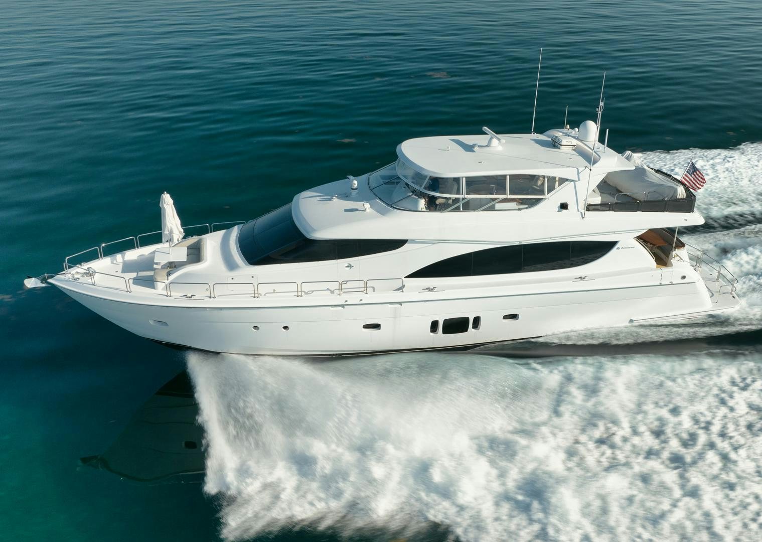 a white yacht on the water aboard EMMY Yacht for Sale