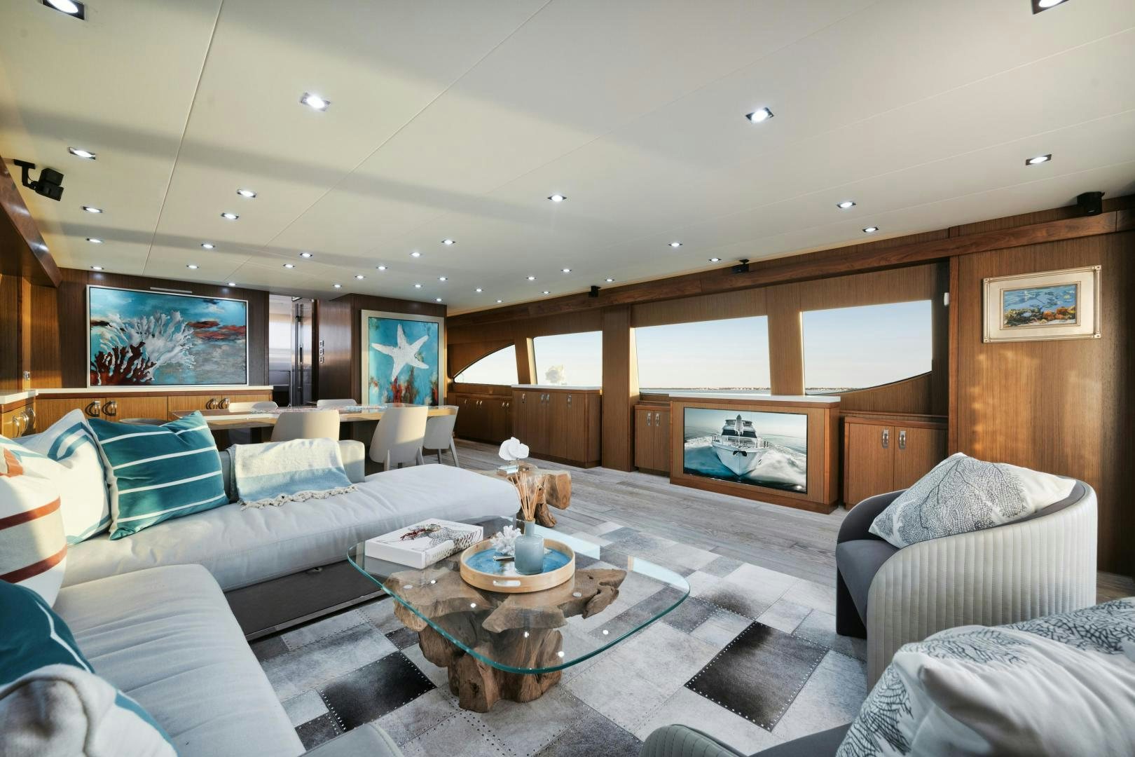 a living room with a large screen aboard EMMY Yacht for Sale