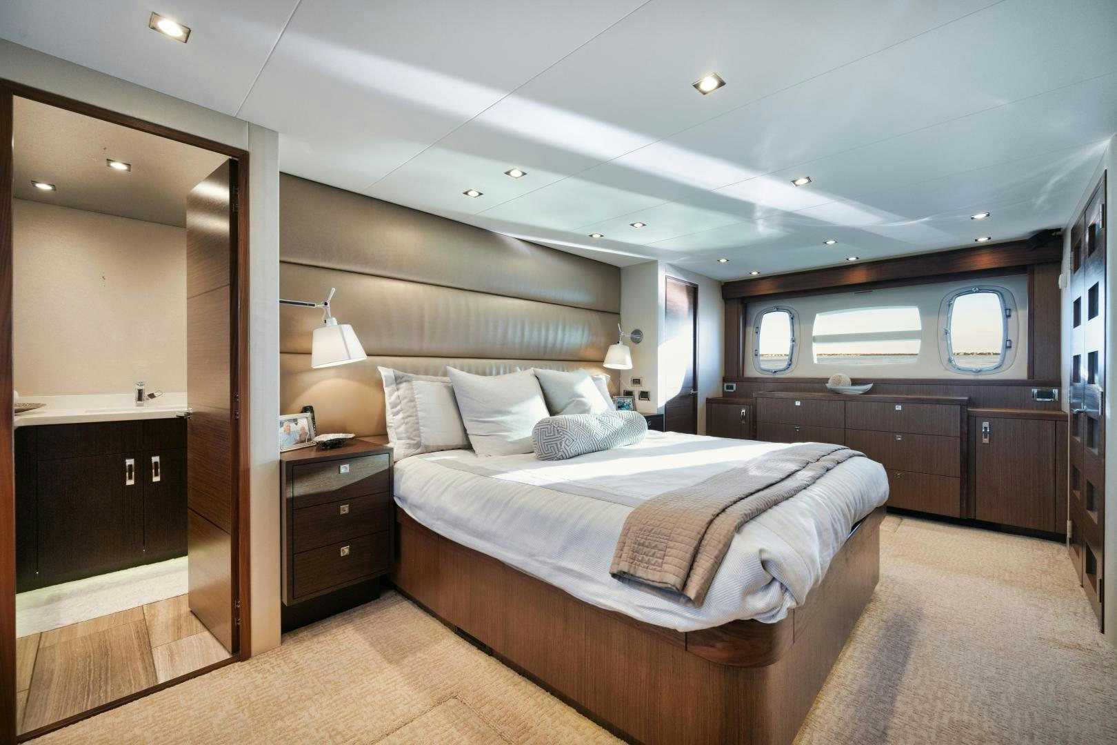 a bedroom with a large bed aboard EMMY Yacht for Sale