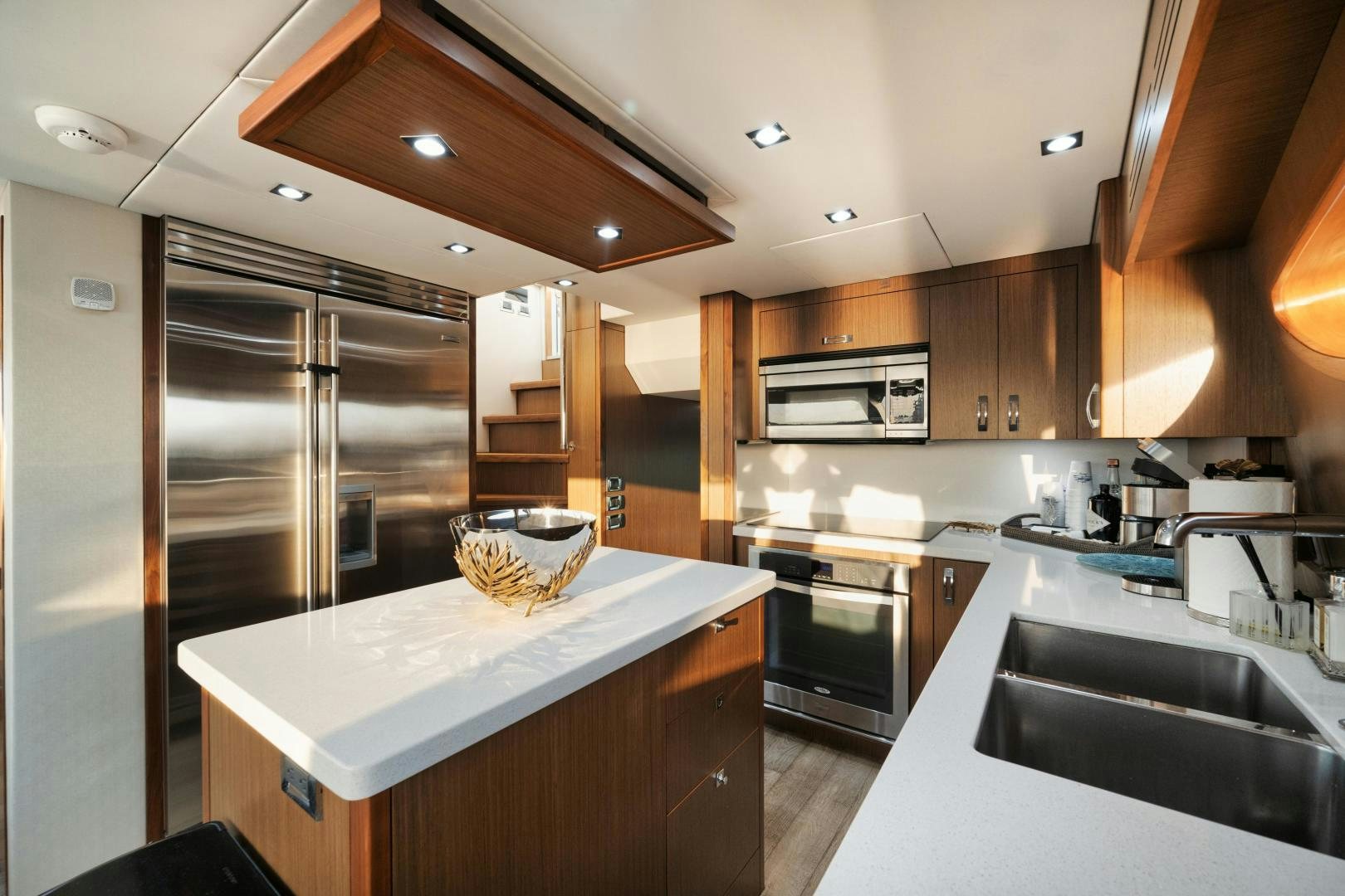 a kitchen with stainless steel appliances aboard EMMY Yacht for Sale