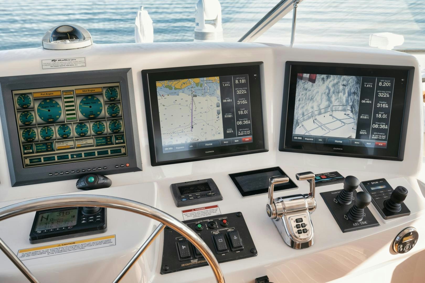 a desk with computers and other electronics aboard EMMY Yacht for Sale