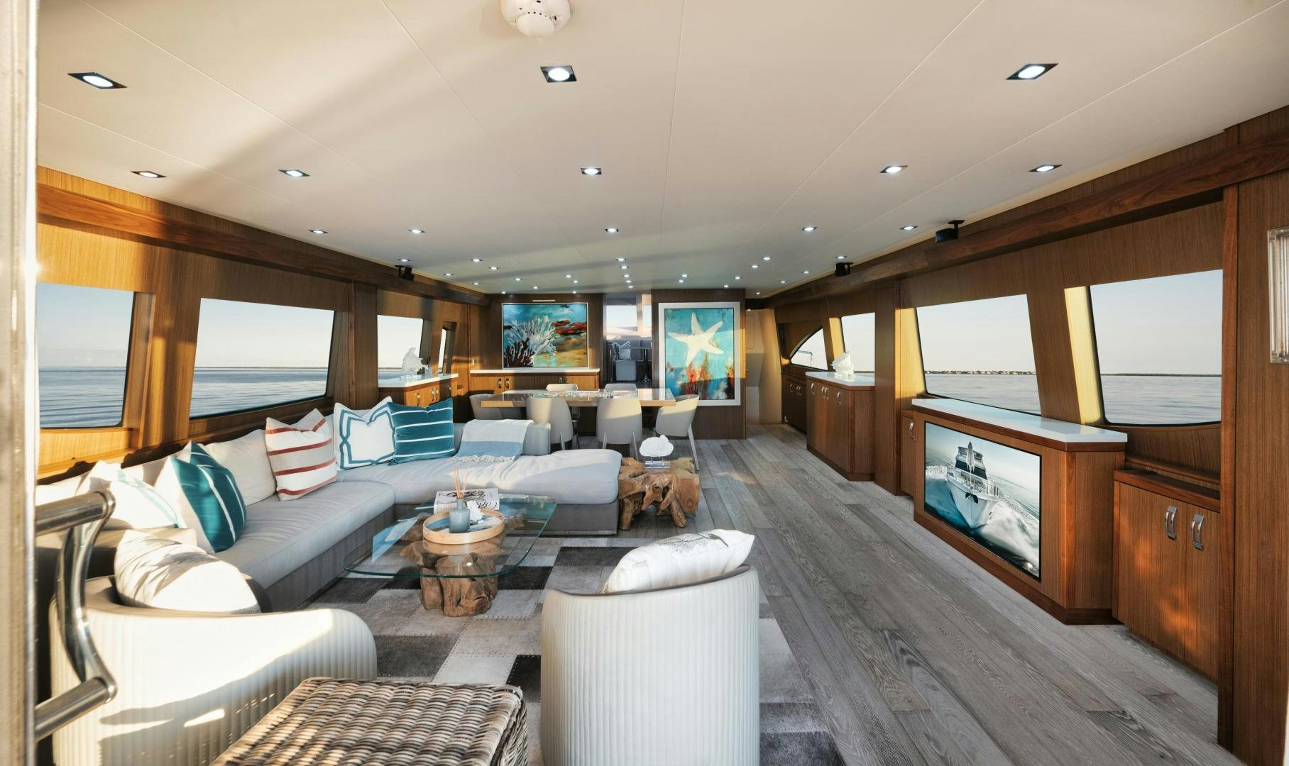 a living room with a large wood floor aboard EMMY Yacht for Sale