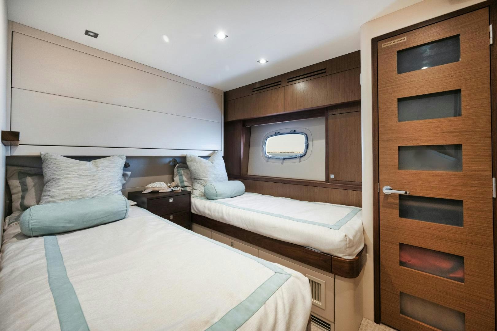a room with two beds aboard EMMY Yacht for Sale