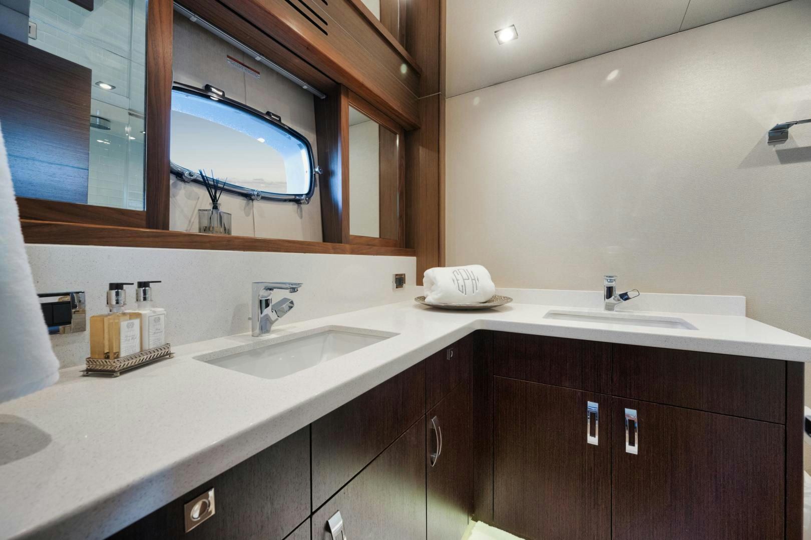a bathroom with a large mirror aboard EMMY Yacht for Sale