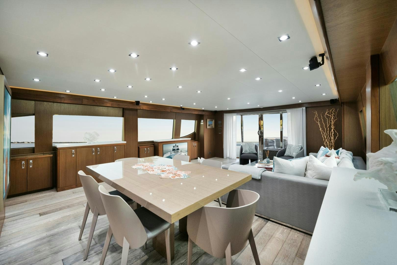 a room with a table and chairs aboard EMMY Yacht for Sale