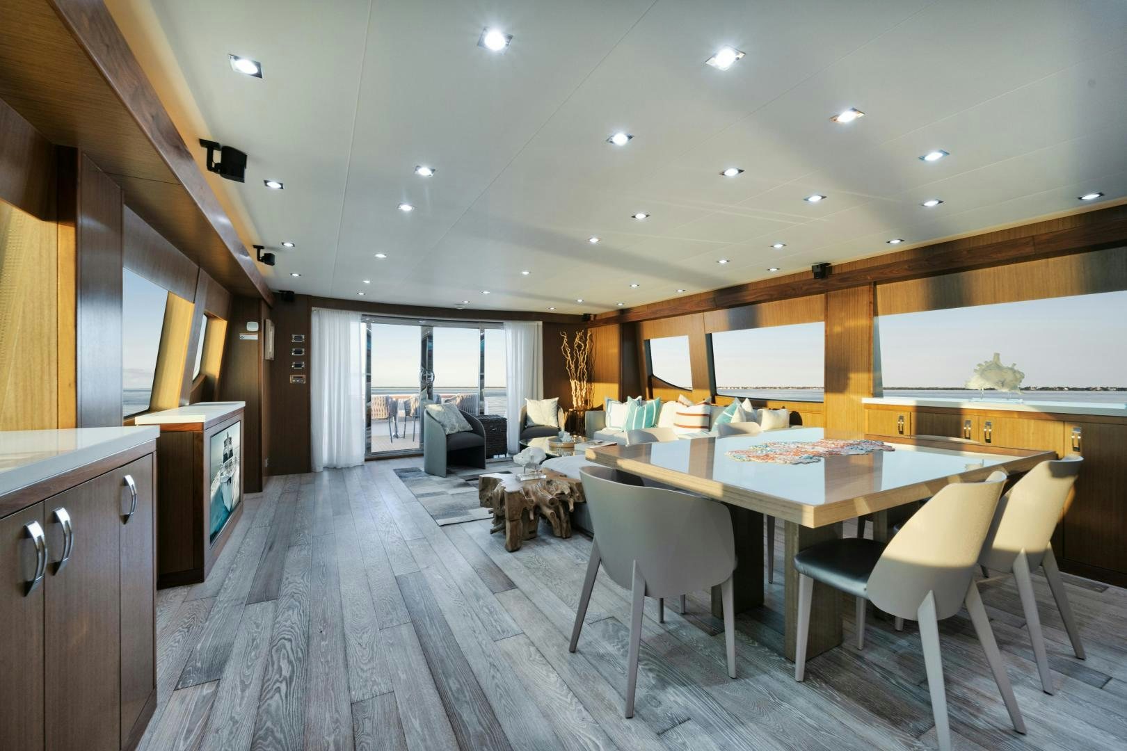 a large kitchen with a large table and chairs aboard EMMY Yacht for Sale