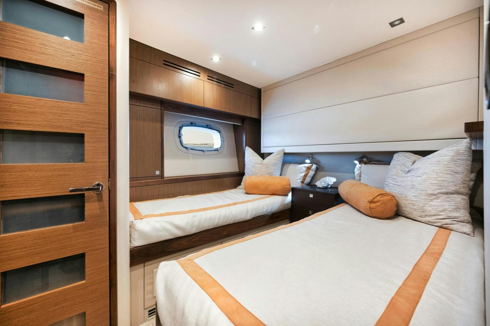 a couple of beds in a room aboard EMMY Yacht for Sale