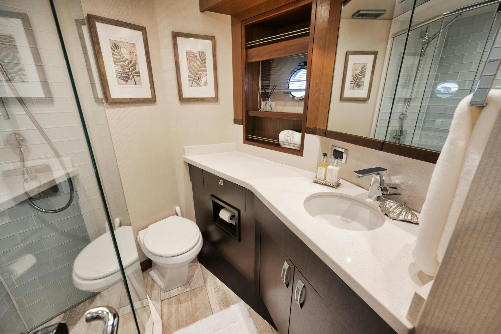 a bathroom with a glass shower aboard EMMY Yacht for Sale