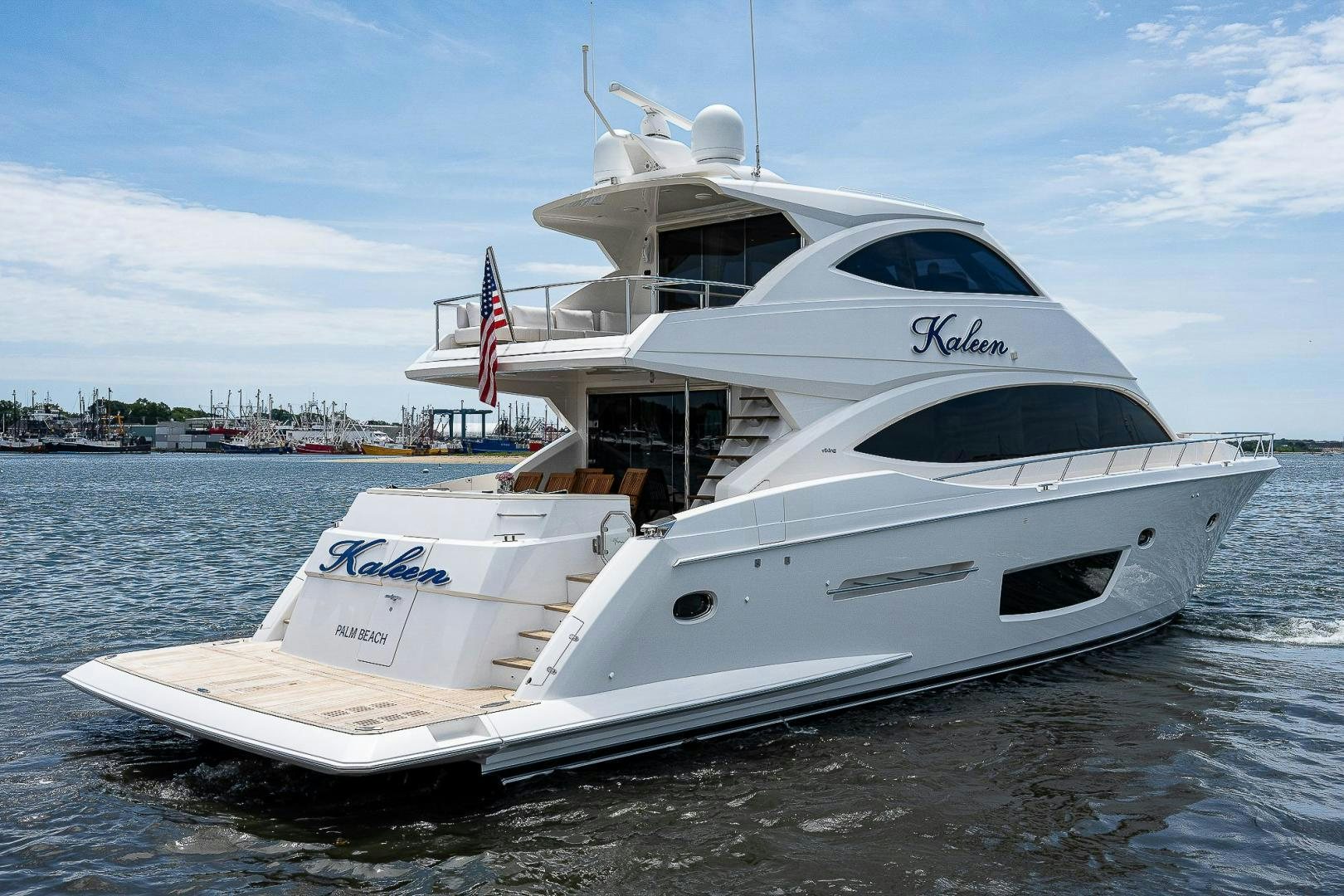 a white boat on the water aboard KALEEN Yacht for Sale