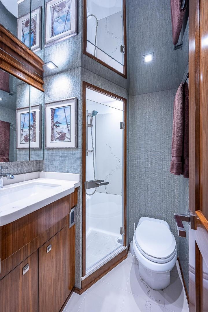 a bathroom with a toilet and sink aboard KALEEN Yacht for Sale