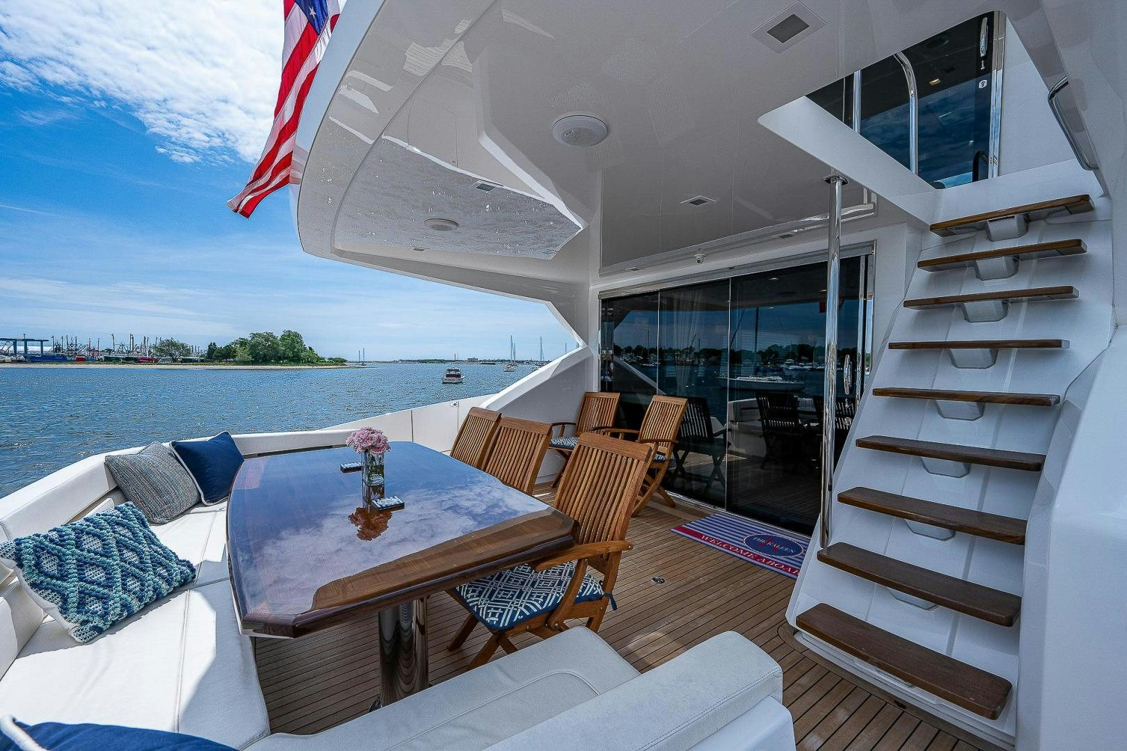 a room with a table and chairs aboard KALEEN Yacht for Sale