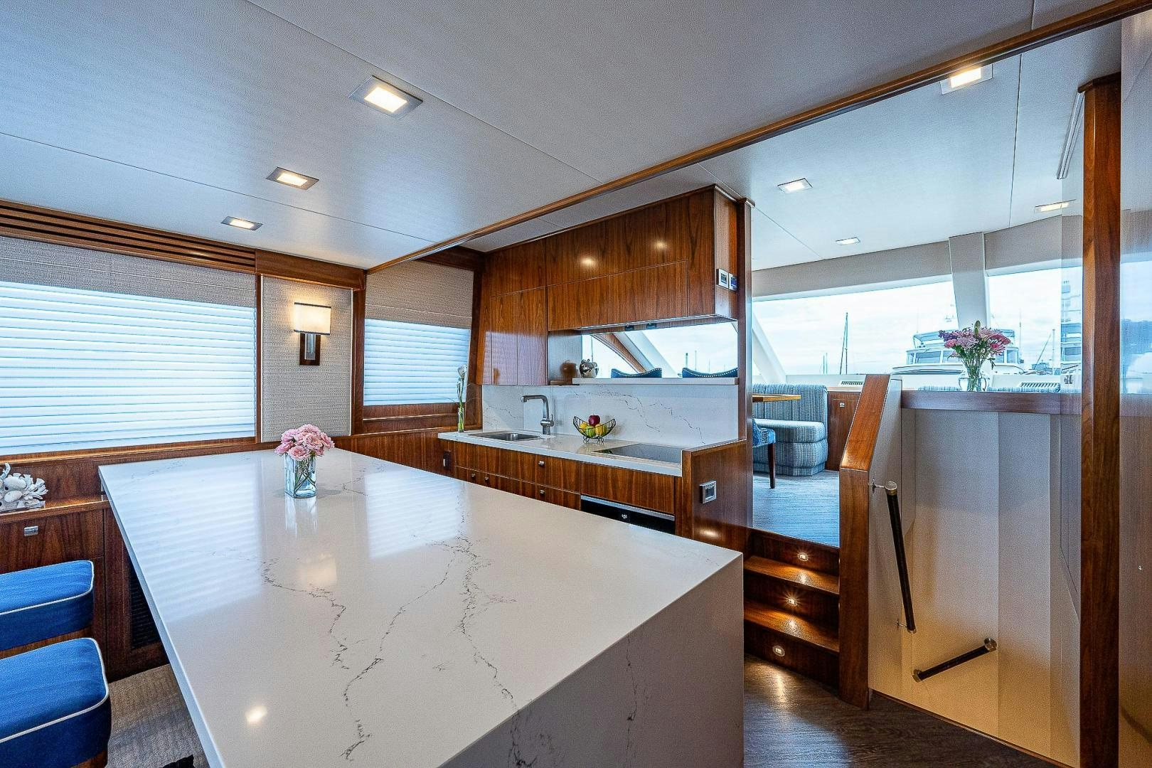 a kitchen with a large island aboard KALEEN Yacht for Sale