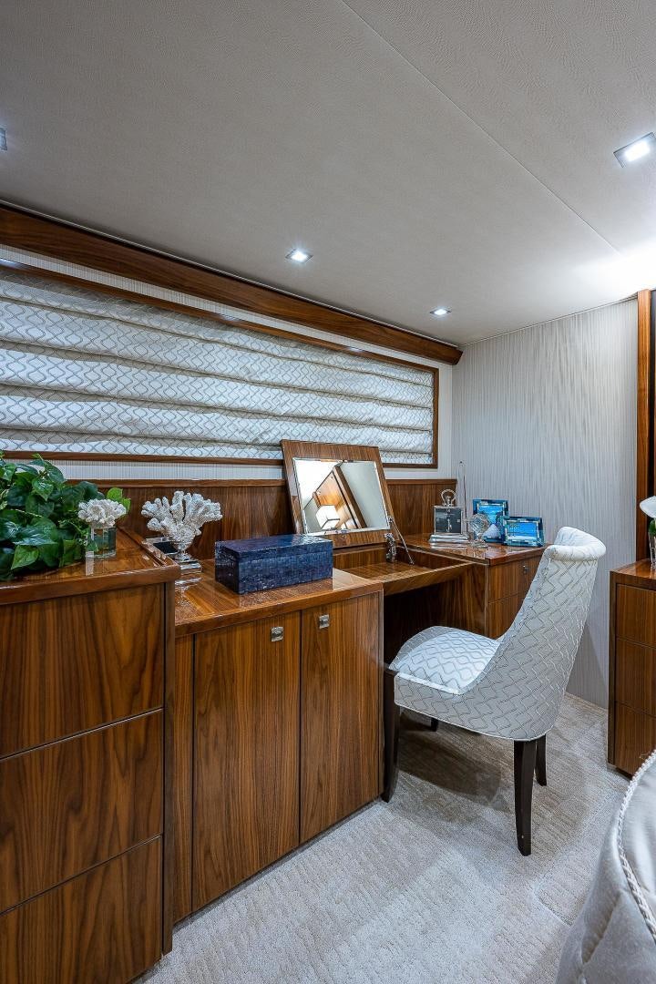 a room with a desk and a chair aboard KALEEN Yacht for Sale