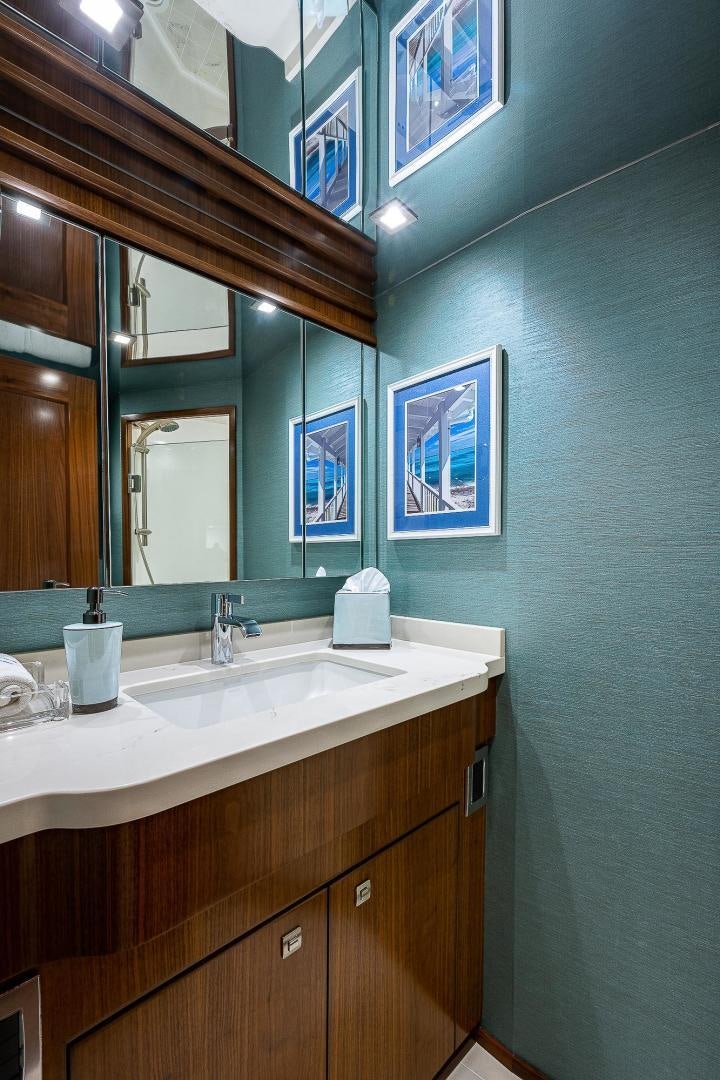 a bathroom with a sink and a mirror aboard KALEEN Yacht for Sale