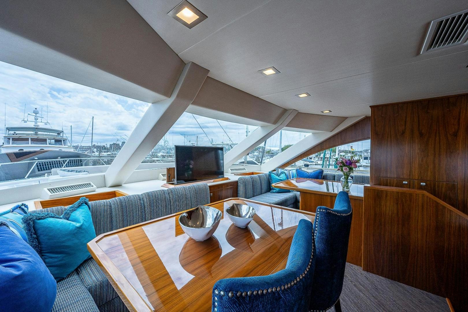 a room with a table and chairs aboard KALEEN Yacht for Sale
