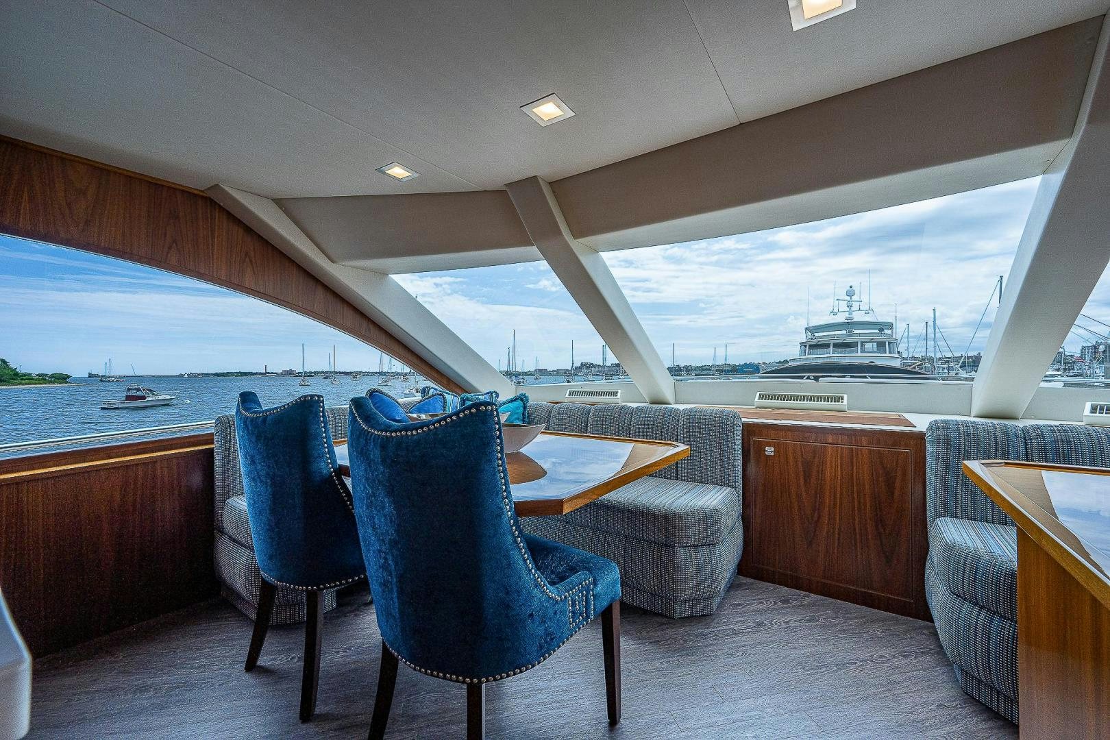 a room with a table and chairs aboard KALEEN Yacht for Sale