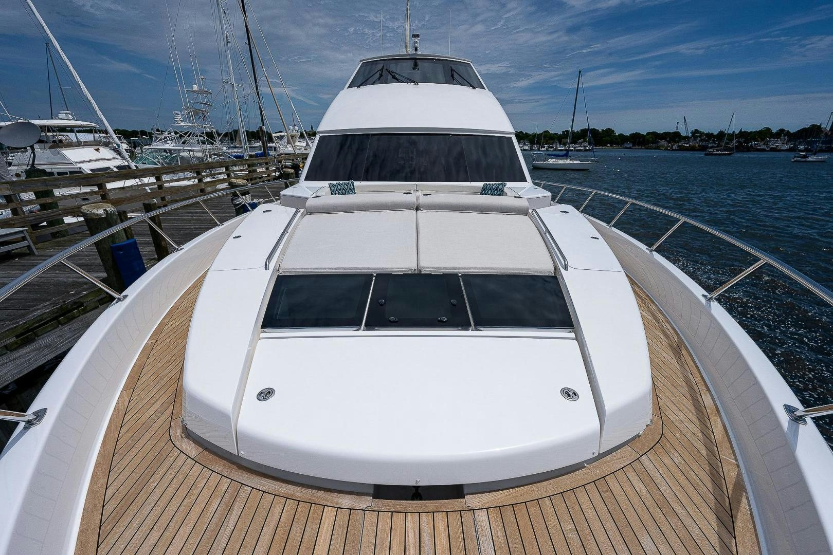 a white yacht on a dock aboard KALEEN Yacht for Sale