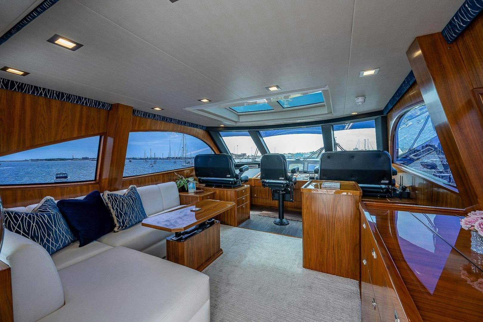 a living room with a large window aboard KALEEN Yacht for Sale