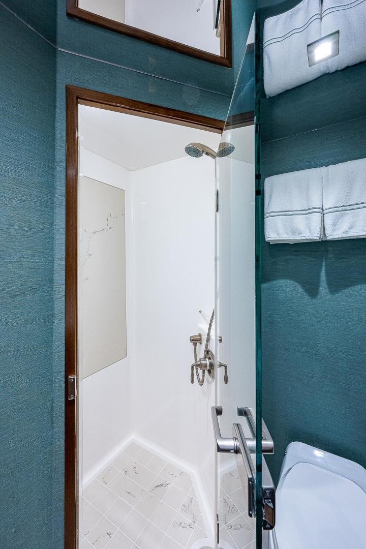 a bathroom with a white door aboard KALEEN Yacht for Sale