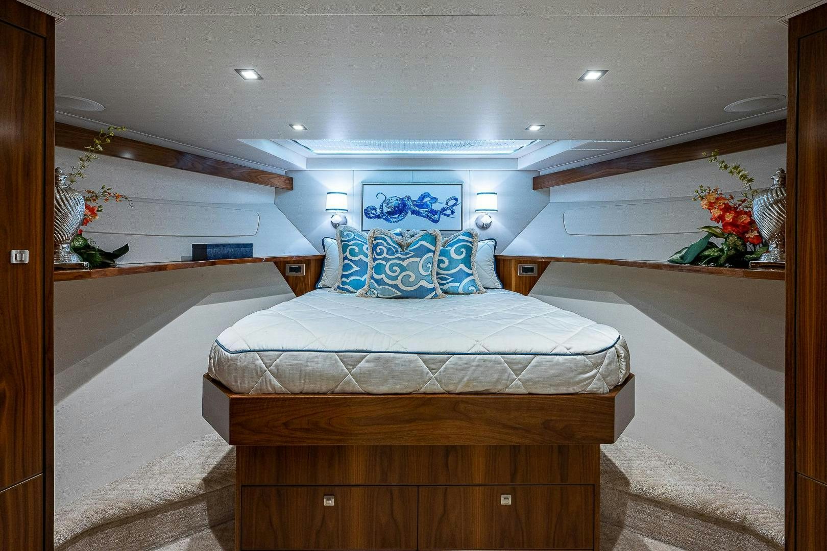 a bedroom with a bed and a desk aboard KALEEN Yacht for Sale