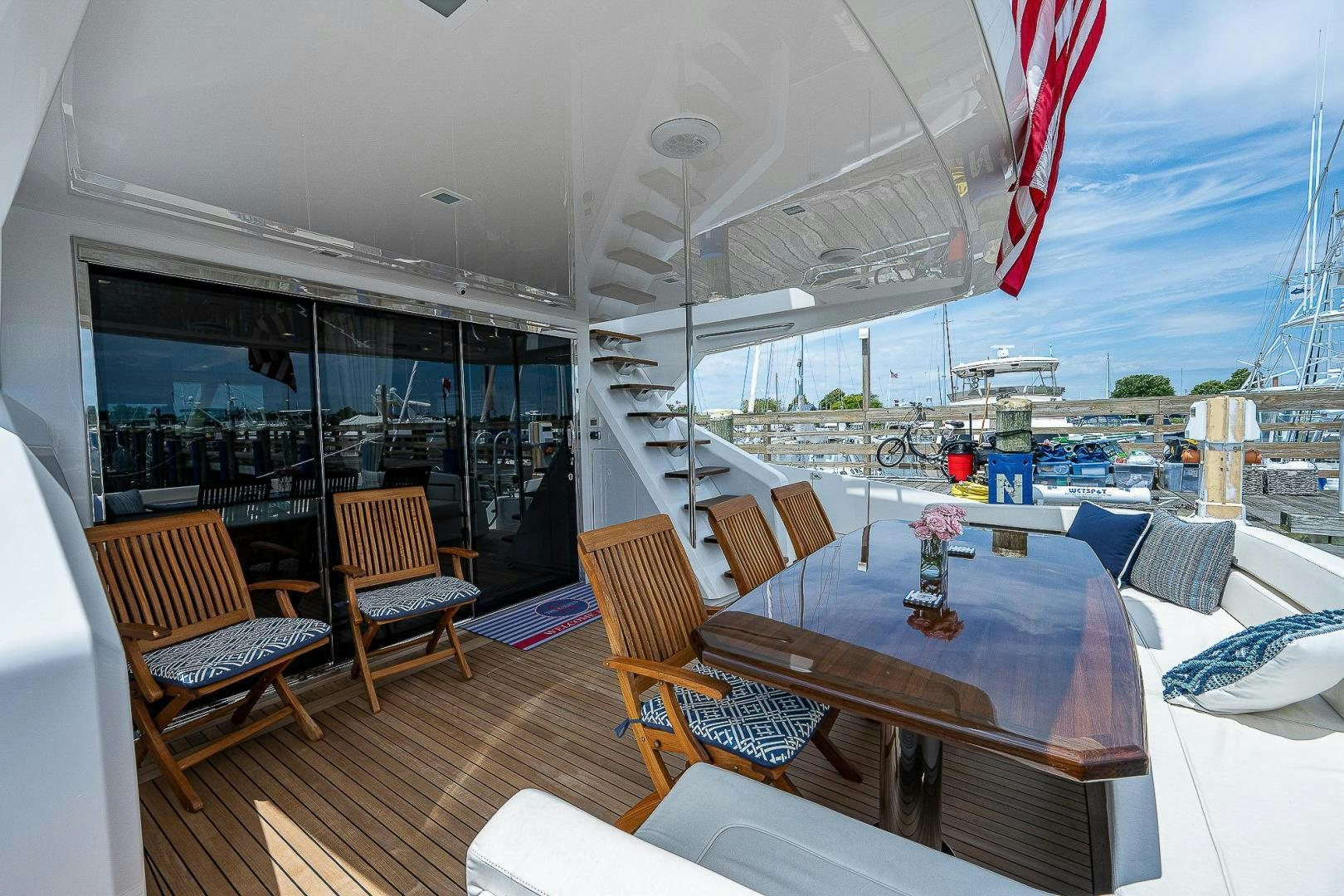 a boat with a table and chairs aboard KALEEN Yacht for Sale
