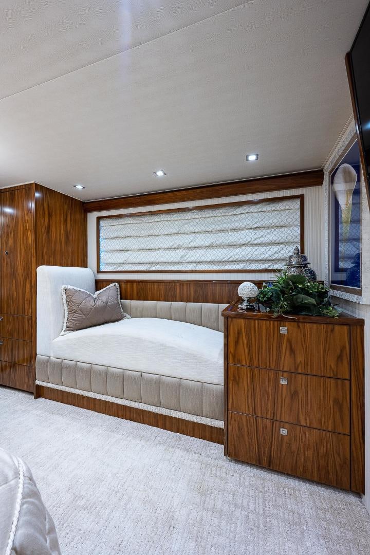 a bedroom with a bed and a dresser aboard KALEEN Yacht for Sale