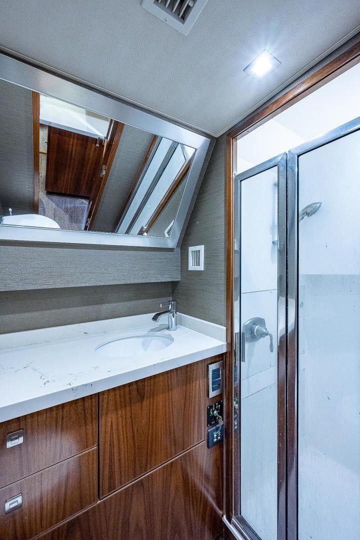 a bathroom with a sink and a mirror aboard KALEEN Yacht for Sale