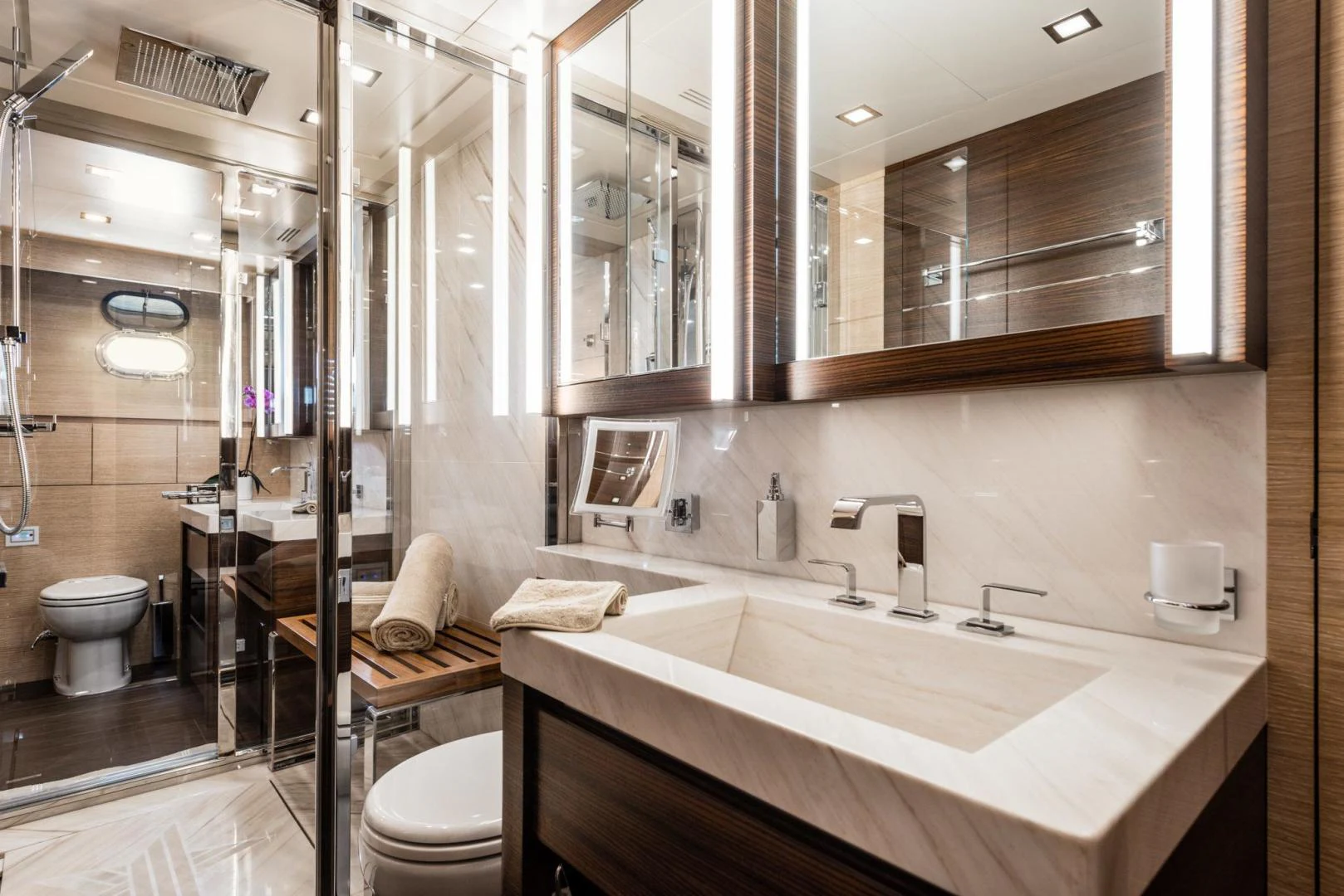 a bathroom with a large mirror aboard WINGS SPREAD Yacht for Sale