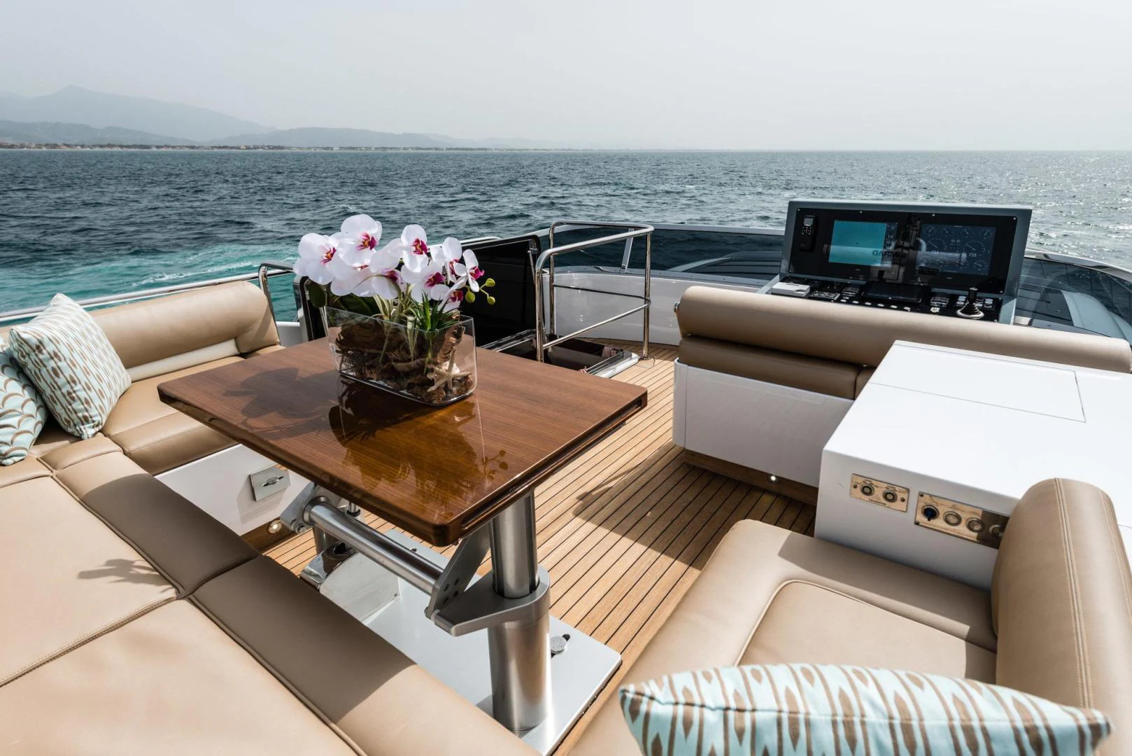 a table with flowers on it aboard WINGS SPREAD Yacht for Sale