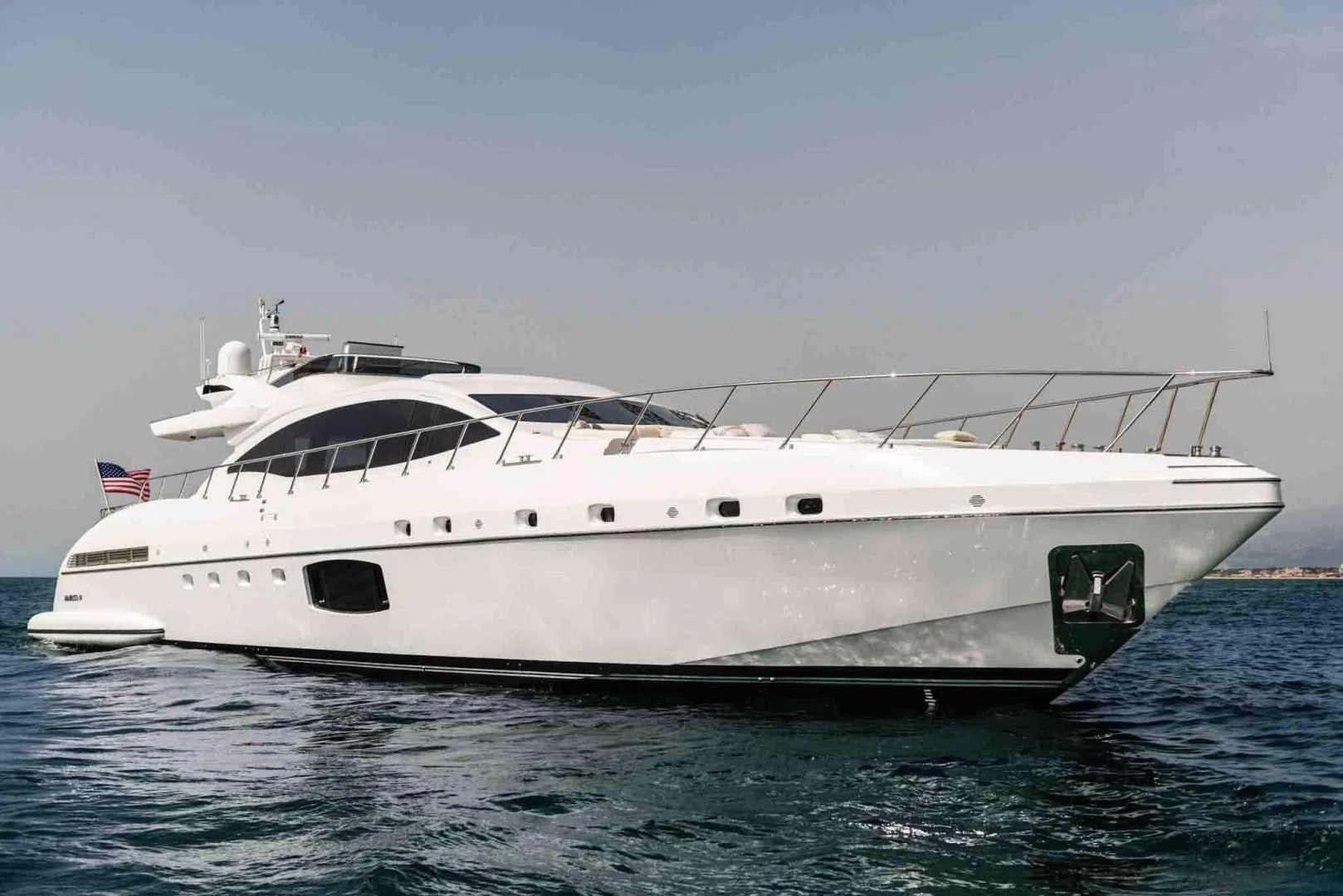 a white yacht on the water aboard WINGS SPREAD Yacht for Sale