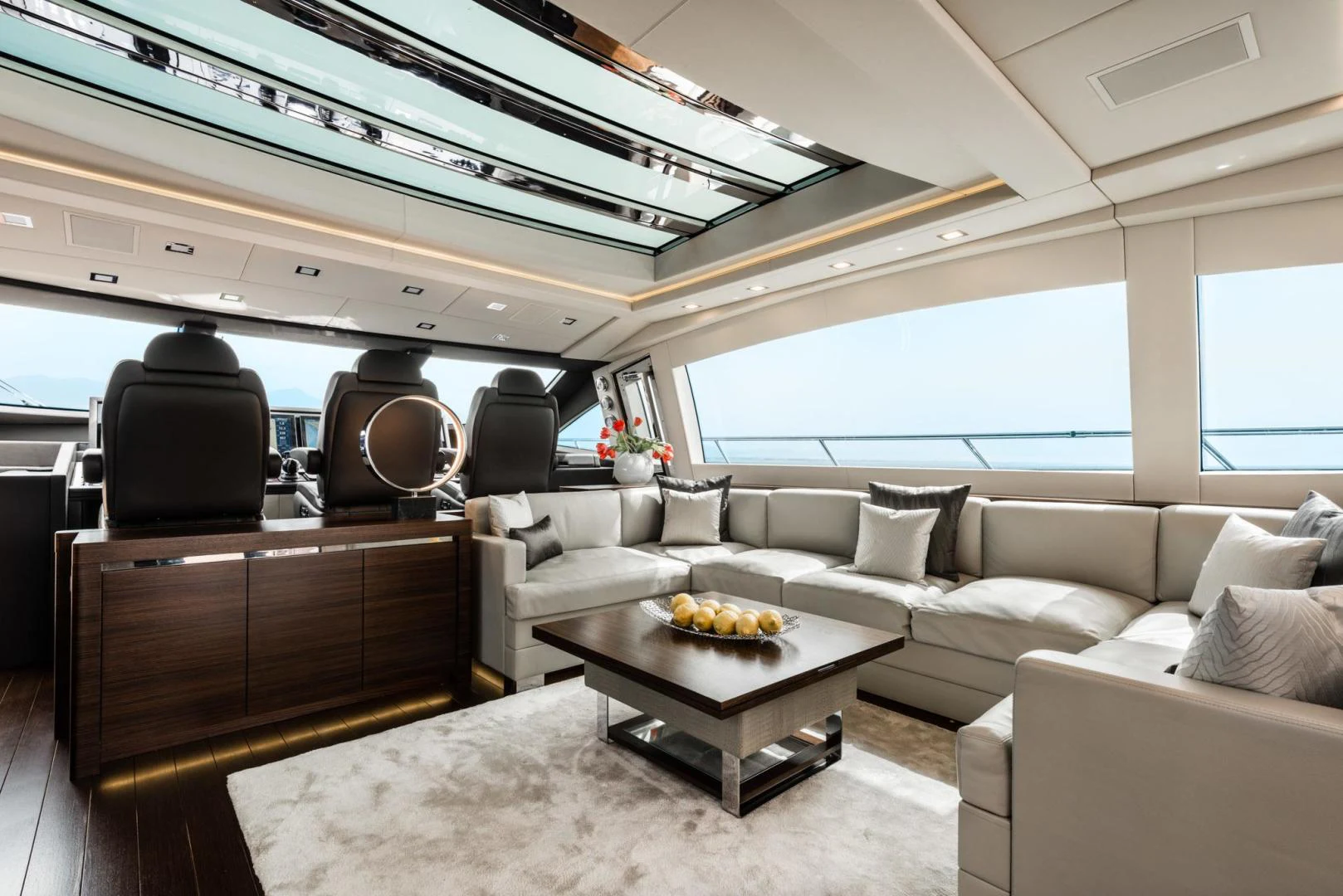 a living room with a couch and a coffee table aboard WINGS SPREAD Yacht for Sale