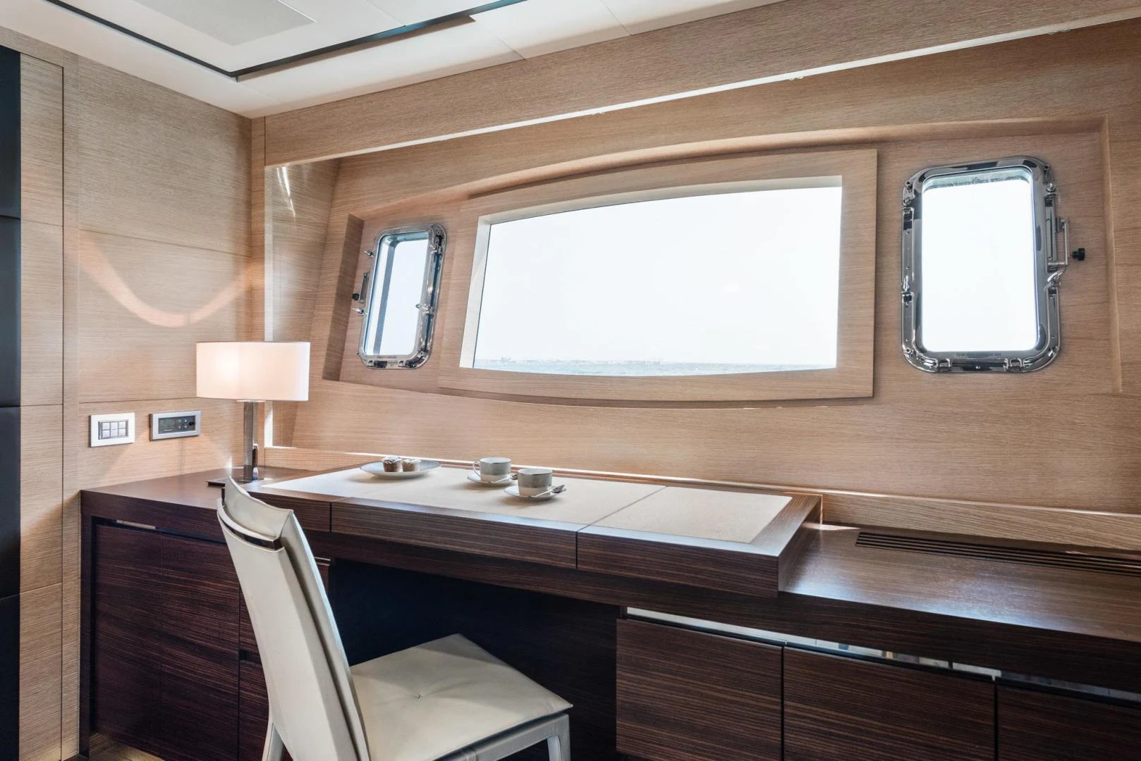a room with a desk and a window aboard WINGS SPREAD Yacht for Sale