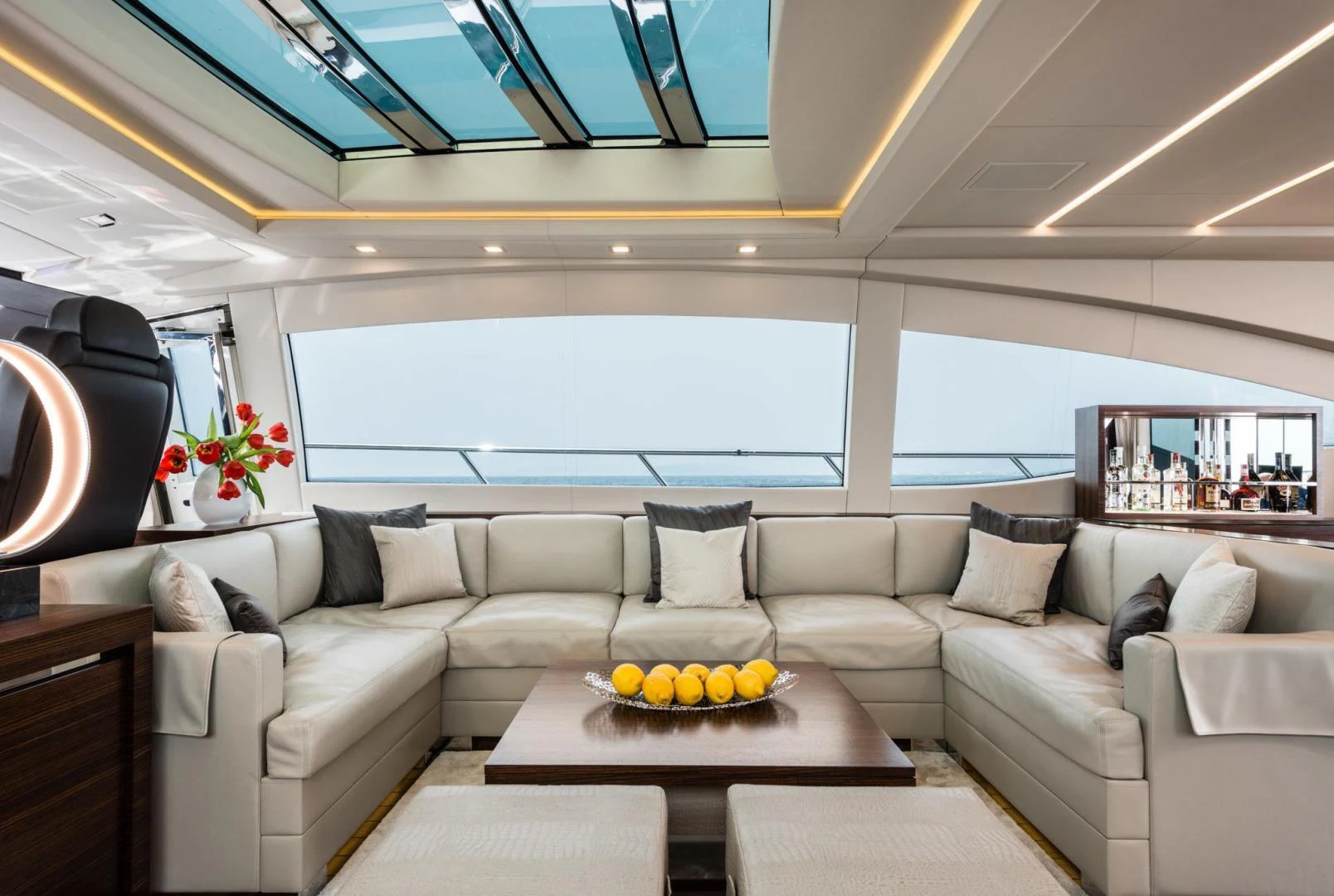 a living room with a couch and a table aboard WINGS SPREAD Yacht for Sale