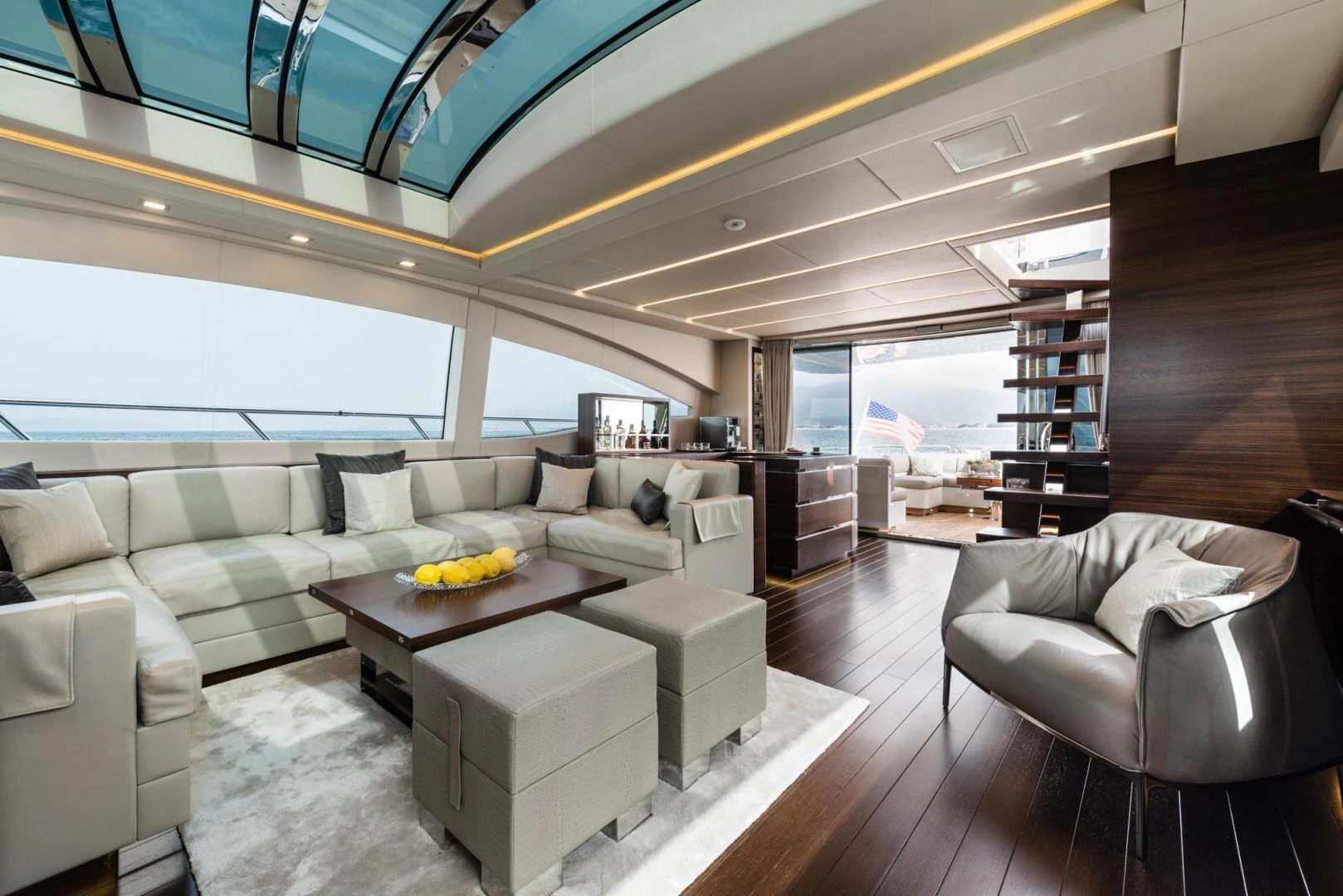 a living room with a large window aboard WINGS SPREAD Yacht for Sale
