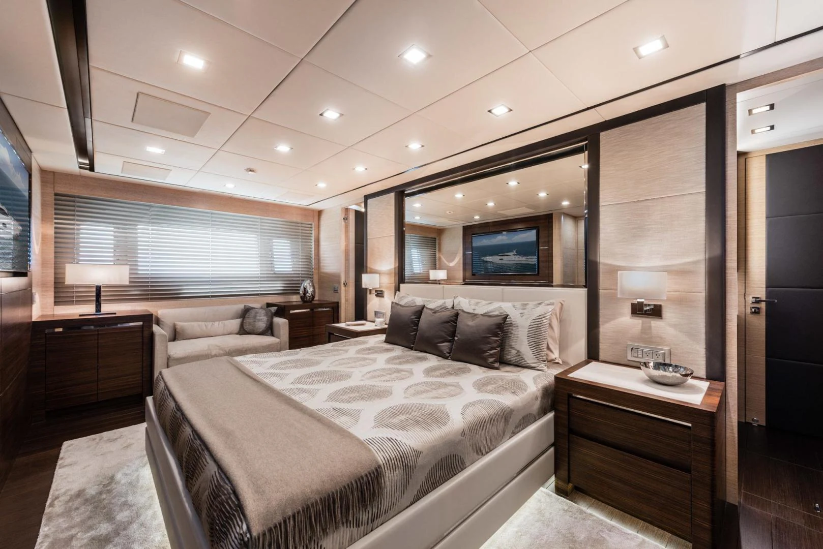 a room with a bed and a television aboard WINGS SPREAD Yacht for Sale