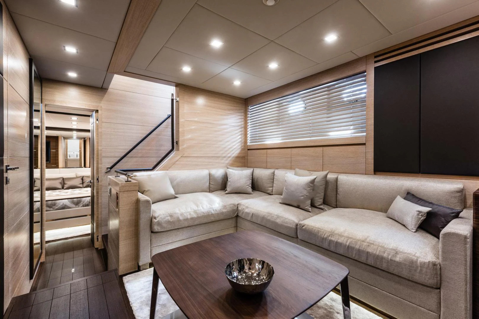 a living room with a couch and a coffee table aboard WINGS SPREAD Yacht for Sale