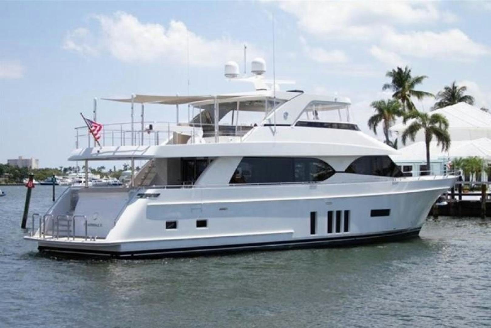 a white yacht on the water aboard TRINITY Yacht for Sale