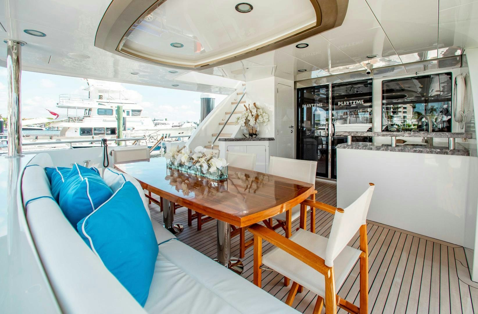 a room with a table and chairs aboard TRINITY Yacht for Sale