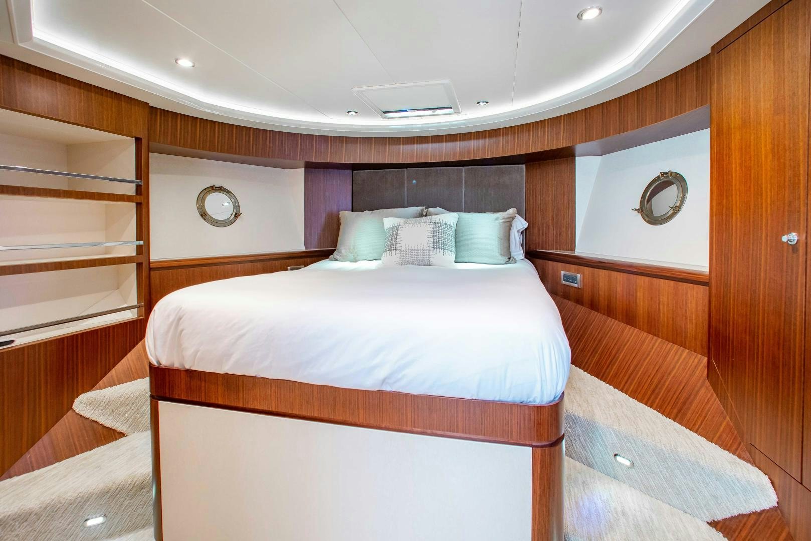 a room with a bed and a shelf aboard TRINITY Yacht for Sale
