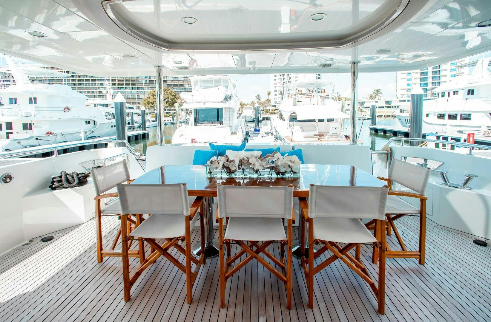 a table set for a dinner aboard TRINITY Yacht for Sale