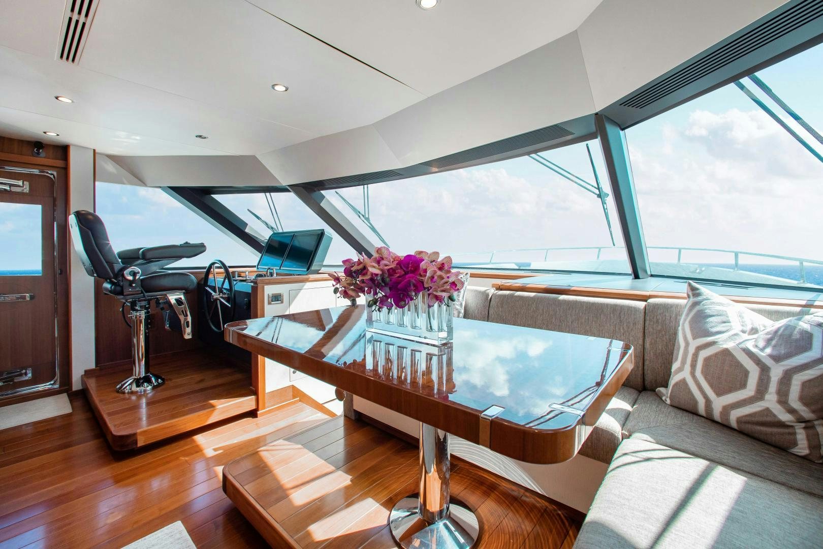 a living room with a large window aboard TRINITY Yacht for Sale