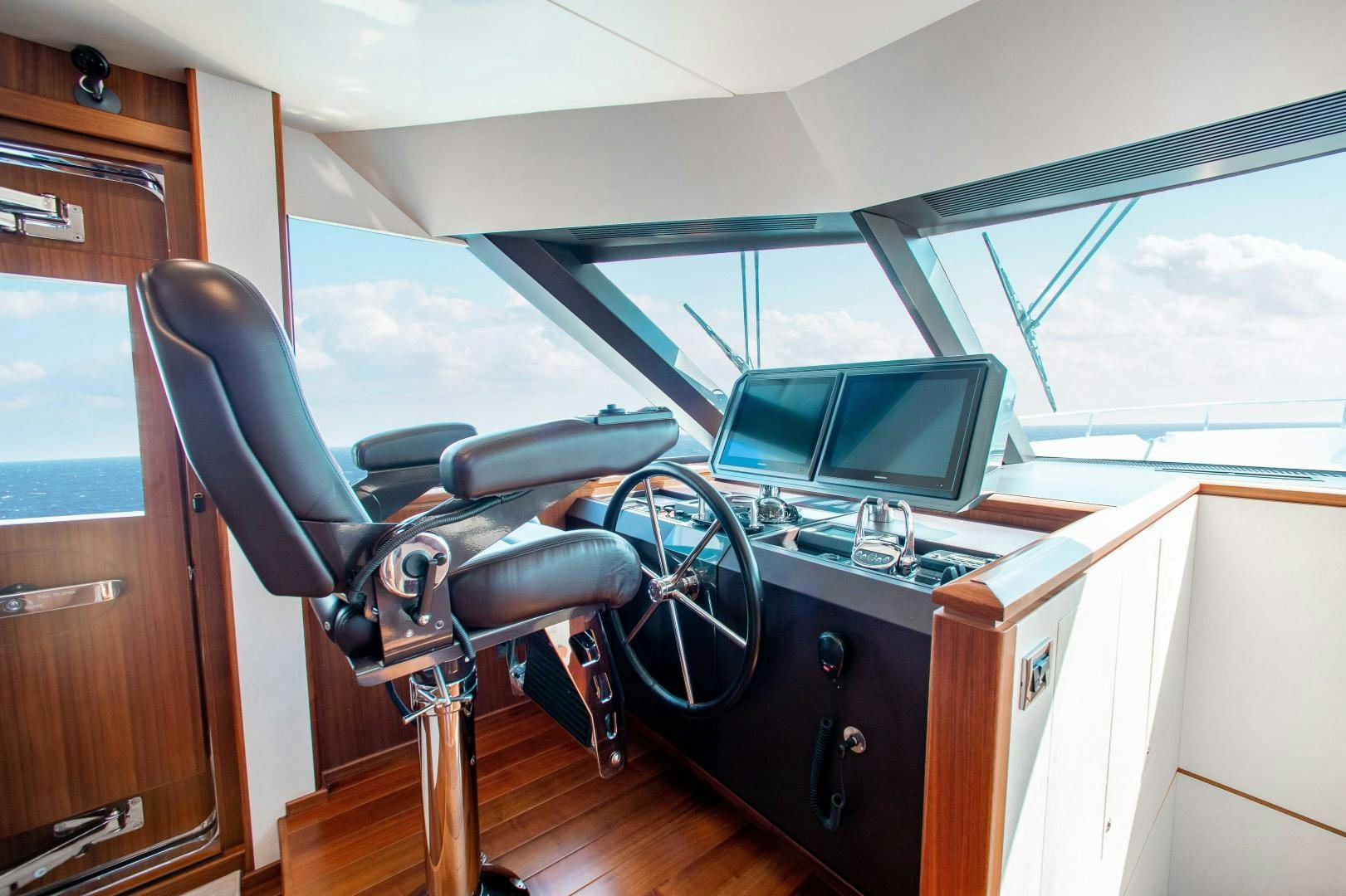 a room with a desk and computer aboard TRINITY Yacht for Sale